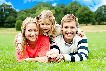 Image showing Happy young family with daughter outdoors