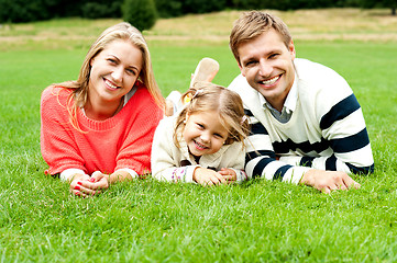 Image showing Young family of three spending a happy day outdoors