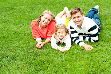 Image showing Laughing family of three having fun together