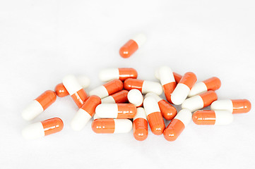 Image showing Group of red-and-white capsules