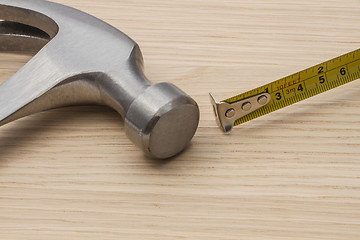 Image showing Old hammer and tape measure 