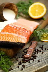 Image showing Fresh salmon with black pepper and dill.