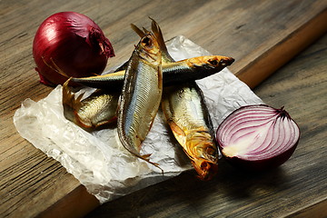 Image showing Smoked sprat and red onion.