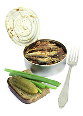 Image showing Anchovies in a tin can with rye bread