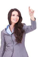 Image showing business woman pushing imaginary screen