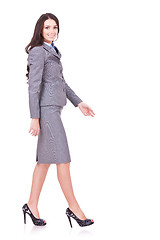 Image showing side view of a business woman walking