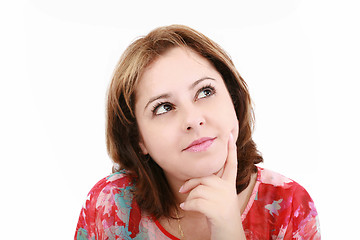 Image showing Closeup of an attractive young woman thinking, isolated on white