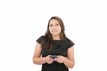 Image showing Close-up of a brunette texting against white background 