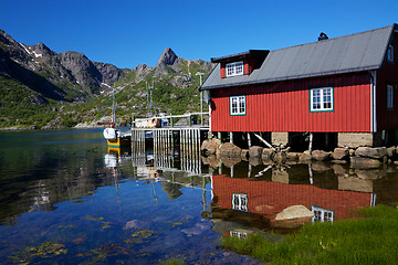 Image showing Fishing hut reflecting in fjord