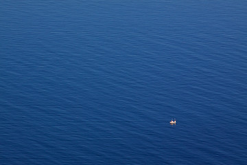 Image showing Seascape with tiny fishing boat