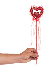 Image showing Hand with heart on a stick