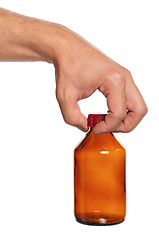 Image showing Hand with small bottle