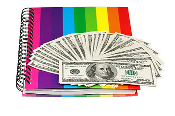 Image showing Dollars and exercise book