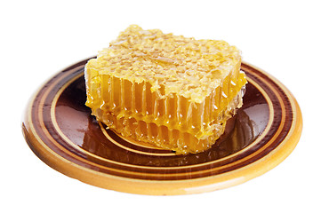 Image showing spoon with honeycomb  on white plate