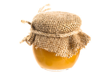 Image showing jar of honey, it is isolated on white