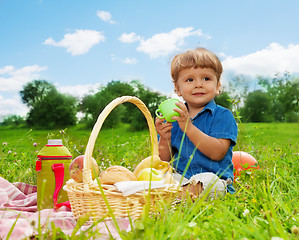 Image showing little boy drinking on picnic