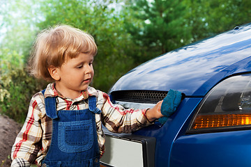 Image showing kid washing car with sponge