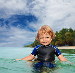 Image showing Happy toddler in wet suit