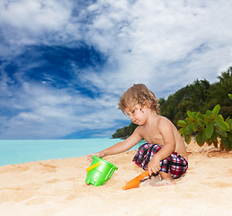 Image showing Kid playing on the seashore