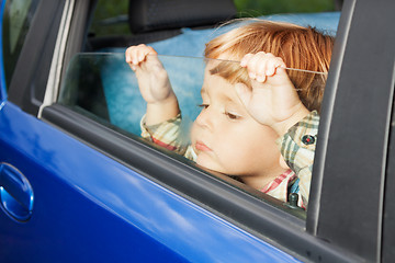 Image showing sad kid tired of trip