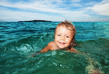 Image showing Kid swimming in the sea