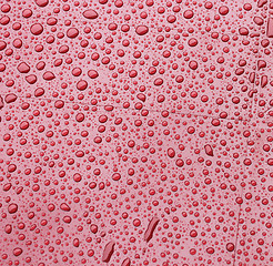 Image showing Red plastic during a rain. Background