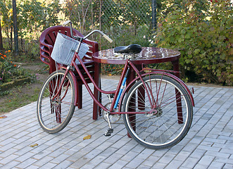 Image showing Plastic furniture and old bicycle