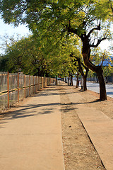 Image showing Long Empty Sunny Sidewalk