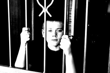 Image showing Young Boy Locked Inside House for Protection