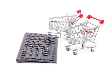 Image showing Computer keyboard with shopping carts