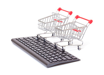 Image showing Computer keyboard with shopping carts