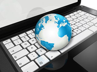 Image showing World globe on a laptop computer