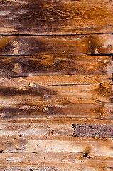 Image showing Old abandoned rural house walls made of boards