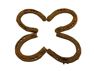 Image showing concept clover made of retro horseshoes isolated 