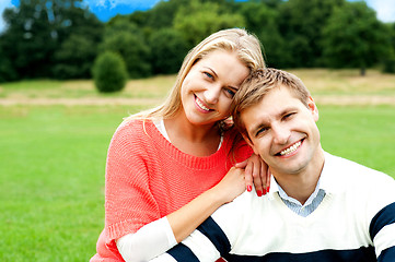 Image showing Lovely young couple striking a smiling pose