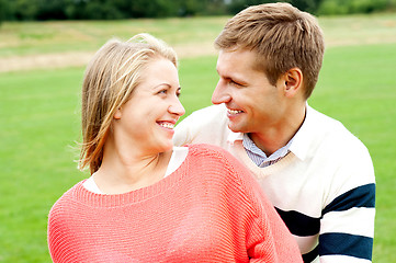 Image showing Couple admiring each other and smiling heartily