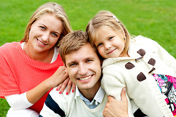 Image showing Joyous family of three. Loving and caring