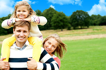 Image showing Family's day out in the park. Everyone enjoying