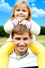 Image showing Charming little girl posing with her father