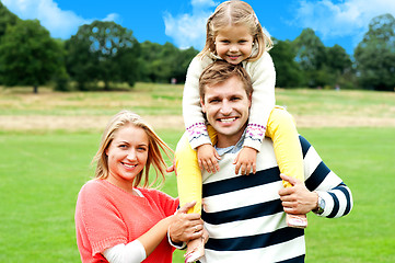 Image showing Fun loving family enjoying spring day outdoors