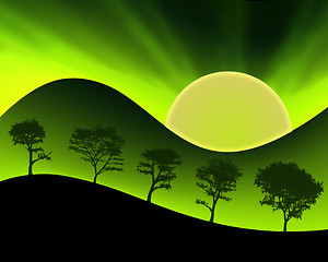 Image showing Green Mountains Sun and Silhouetted Trees