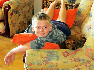 Image showing Boy and Dog on Sofa