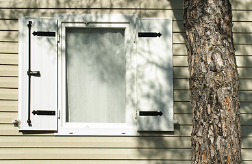 Image showing Window with wooden shutters