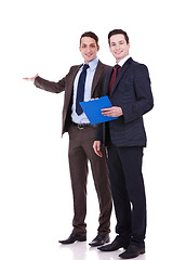 Image showing two young business men presenting 