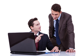 Image showing confident businessmen sharing ideas