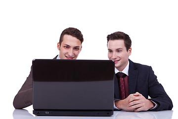 Image showing Two business men working on their laptop