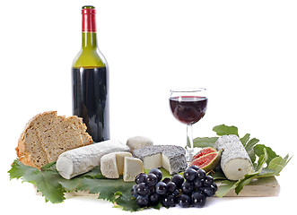 Image showing goat cheeses, fruits and wine