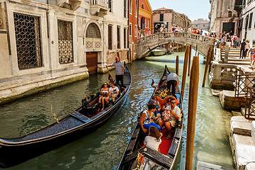 Image showing 16. Jul 2012 - Gondoliers with tourists at canal in Venice, Italy