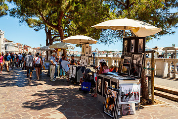 Image showing 16. Jul 2012 - Street vendor selling tourist souvenirs. Most vendors in Venice aren't of Italian origin. 