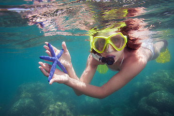 Image showing Woman holding starfish